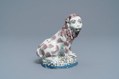 A polychrome Brussels or Lille faience model of a lion, late 18th C.