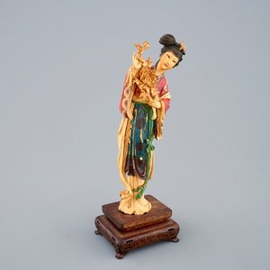 A polychrome Chinese carved ivory figure of Guanyin on wood base, 19th C. — photo 1