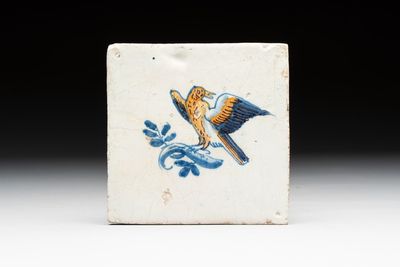 A polychrome Dutch Delft 'bird on a branch' tile, 17th C.