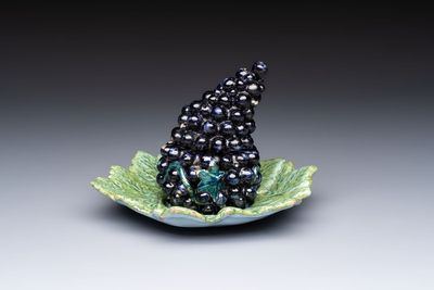 A polychrome Dutch Delft 'Bunch of Grapes' tureen and cover, 18th C.