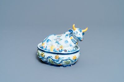 A polychrome Dutch Delft butter tub and cow cover, 18th C.