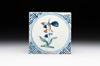 A polychrome Dutch Delft 'butterfly on a campanula' tile, 17th C.