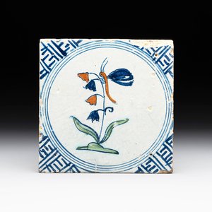 A polychrome Dutch Delft 'butterfly on a campanula' tile, 17th C. — photo 1