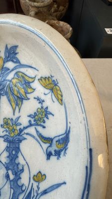 A polychrome Dutch Delft chinoiserie dish with flower vases, a bird and insects — photo 5