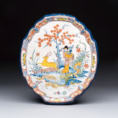 A polychrome Dutch Delft chinoiserie 'Deer and Beauty' plaque, 18th C.