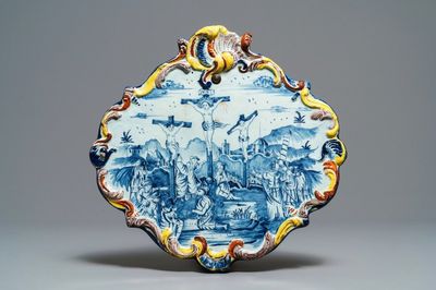 A polychrome Dutch Delft 'Crucifixion' plaque, 18th C.