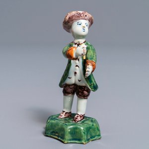 A polychrome Dutch Delft figure of a boy with a hat, 18th C. — 照片 1