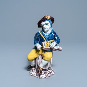 A polychrome Dutch Delft figure of a hurdy-gurdy player, 18th C. — photo 1