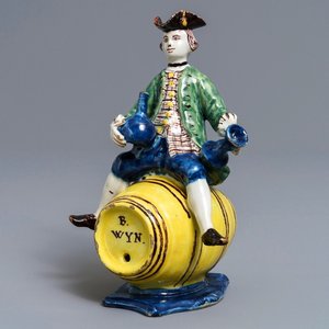 A polychrome Dutch Delft figure of a man on a barrel, 18th C. — 照片 1