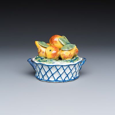 A polychrome Dutch Delft 'Fruit basket' butter tub and cover, 18th C.