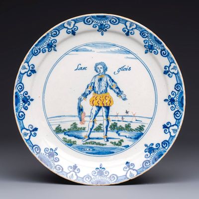 A polychrome Dutch Delft plate inscribed 'Langlois', 1st half 18th C.