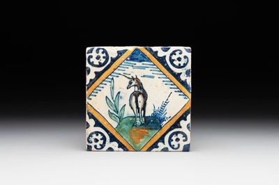A polychrome Dutch Delft maiolica 'diamond' 'unicorn' tile, late 16th C.