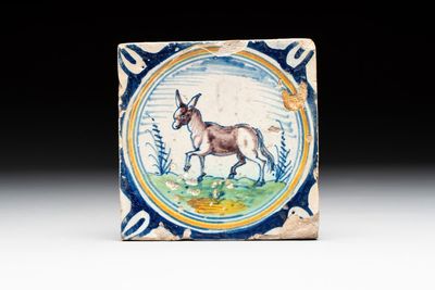 A polychrome Dutch Delft maiolica 'donkey' medallion tile, late 16th C.