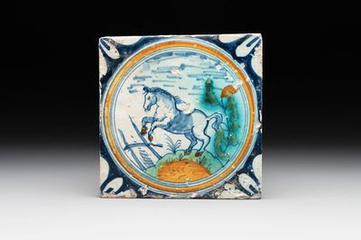 A polychrome Dutch Delft maiolica 'horse' medallion tile, late 16th C.
