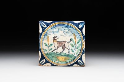 A polychrome Dutch Delft maiolica 'medallion' 'dog' tile, late 16th C.
