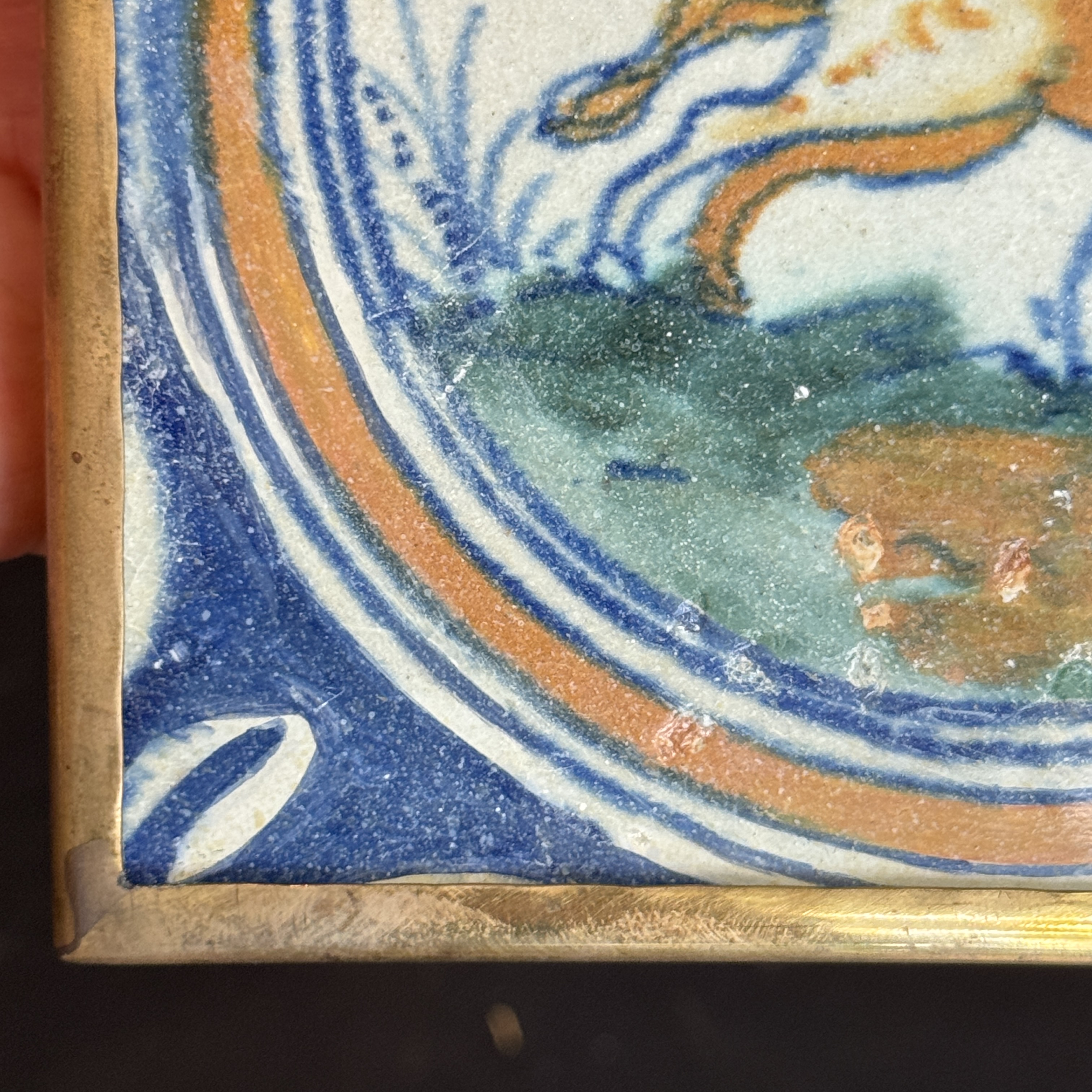 A polychrome Dutch Delft maiolica medallion tile with a leaping horse — photo 1
