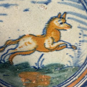 A polychrome Dutch Delft maiolica medallion tile with a leaping horse — photo 4