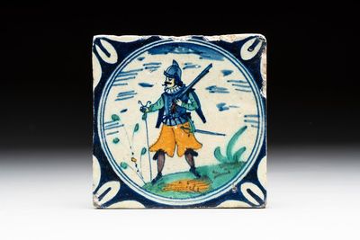 A polychrome Dutch Delft maiolica 'soldier' medallion tile, late 16th C.