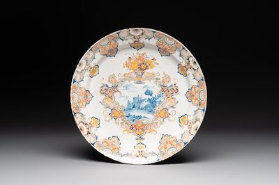 A polychrome Dutch Delft mixed technique dish with a fine landscape, 18th C.