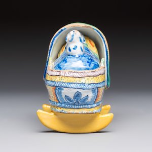 A polychrome Dutch Delft model of a child in a cradle with a cat — photo 3