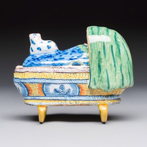 A polychrome Dutch Delft model of a child in a cradle with a cat — photo 4