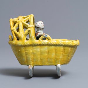 A polychrome Dutch Delft model of a girl in a cradle, 18th C. — 照片 4