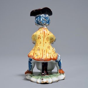 A polychrome Dutch Delft model of a man near a stove, 18th C. — photo 4