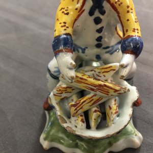 A polychrome Dutch Delft model of a man near a stove, 18th C. — photo 9