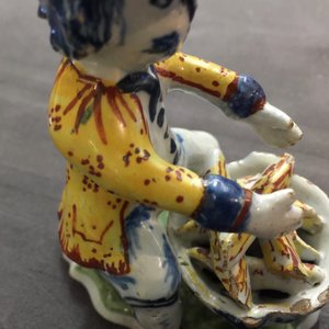 A polychrome Dutch Delft model of a man near a stove, 18th C. — photo 10