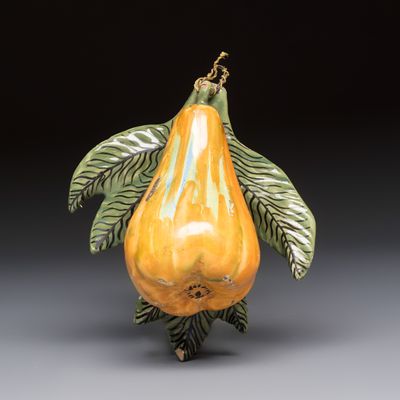 A polychrome Dutch Delft model of a pear, 19th C.