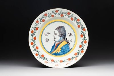 A polychrome Dutch Delft 'orangist' 'royal portrait' plate, 18th C.