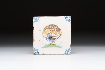 A polychrome Dutch Delft 'peacock' tile, 17th C.