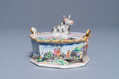 A polychrome Dutch Delft petit feu and doré butter tub with a reclining cow, 19th C.
