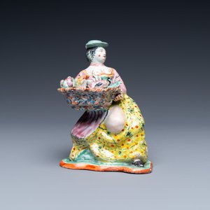 A polychrome Dutch Delft petit feu figure of a bare-breasted flower seller, 18th C. — photo 2
