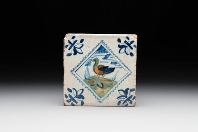 A polychrome Dutch Delft 'stamp' 'duck or goose' tile, late 16th C.