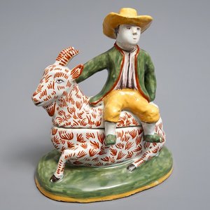 A polychrome Dutch Delft-style butter tub and cover in the shape of a buckrider, prob. Dèsvres, France, ca. 1900 — photo 1