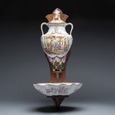 A polychrome French faience wall fountain and basin, 19th C.