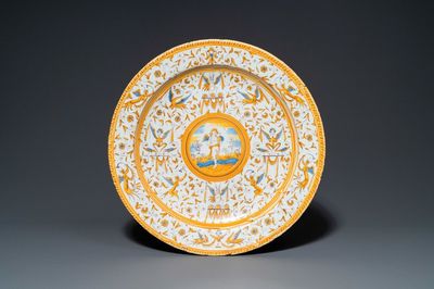 A polychrome 'grotesque' dish with a putto holding an orb, Willem Jansz. Verstraeten, Haarlem, 1645-1655