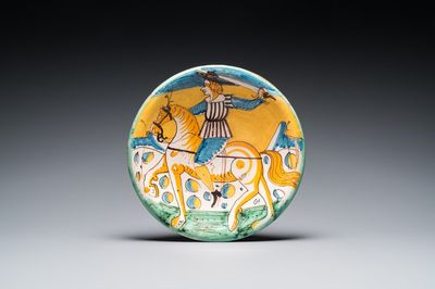 A polychrome Italian maiolica dish with a horserider, Montelupo, 17th C.
