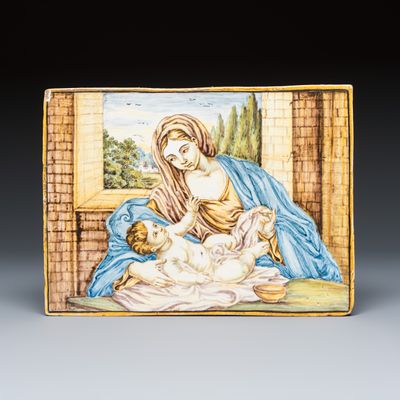 A polychrome Italian maiolica 'Madonna and Child' plaque, 18th C.