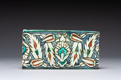 A polychrome Iznik-style Damascus pottery frieze tile with floral design, 17/18th C.
