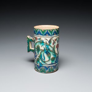 A polychrome Iznik-style mug with tulips and carnations, Kutahya, Turkey, 19th C. — photo 1