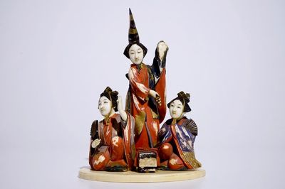 A polychrome Japanese ivory okimono of ladies presenting a gift, Meiji, early 20th C.
