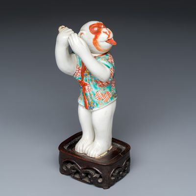 A polychrome Japanese nodding head Sarumawashi monkey playing kagura suzu, Meiji, 19th C.