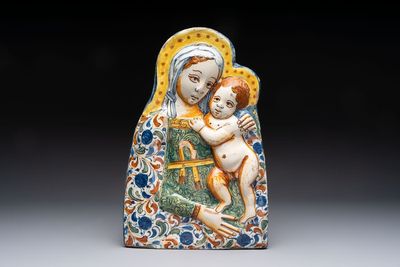 A polychrome molded Italian maiolica 'Madonna and Child' plaque, 17th C.
