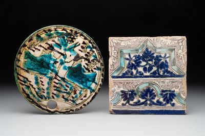 A polychrome Qajar beehive-cover and a tile with floral design, Iran, 18th C.
