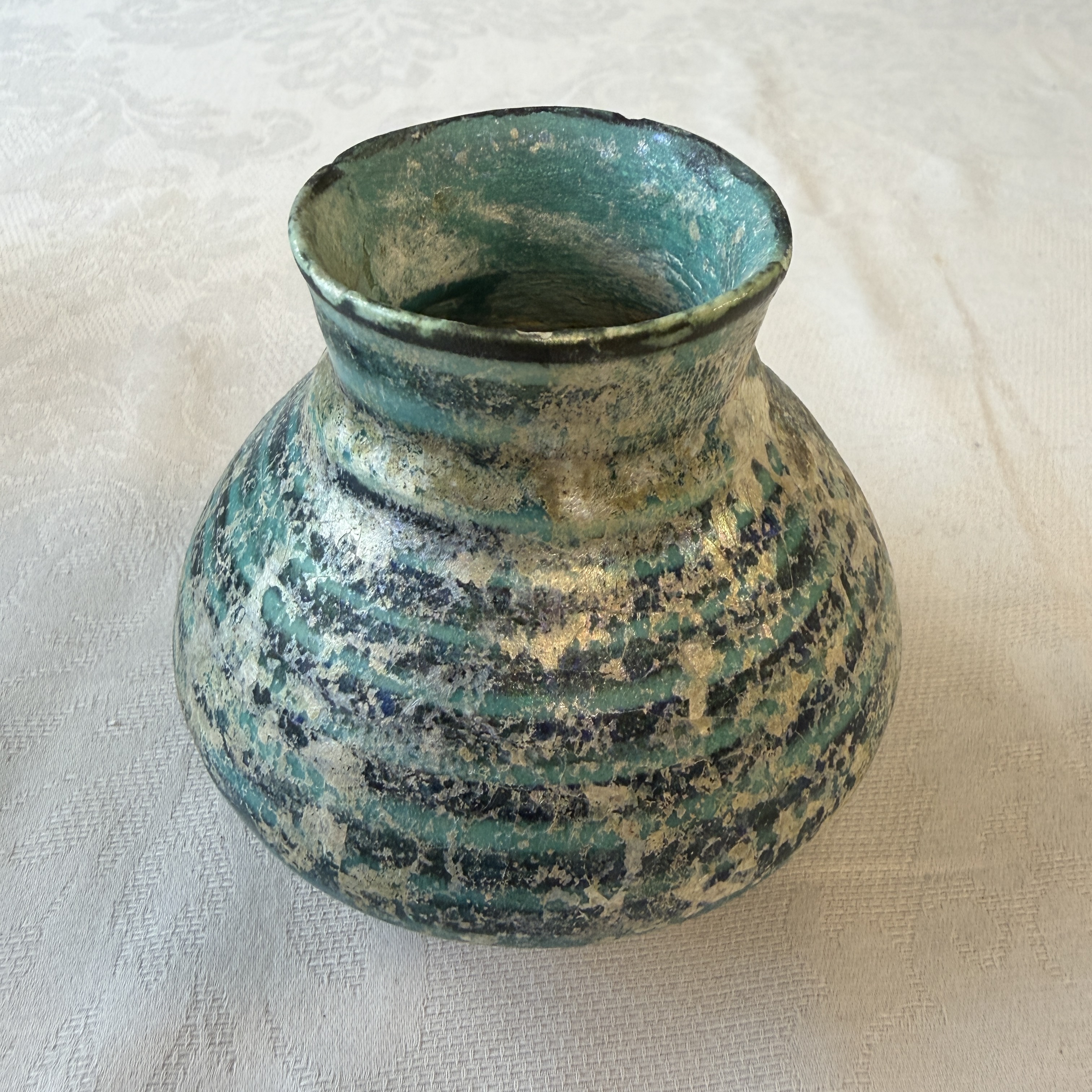 A Raqqa turquoise and black pottery jar with horizontal stripes — photo 1