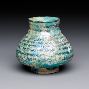 A Raqqa turquoise and black pottery jar with horizontal stripes — photo 1