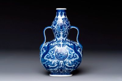 A rare and fine Chinese blue and white double gourd 'dragon' vase with ruyi handles, Qianlong mark and of the period