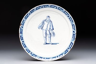 A rare blue and white Dutch Delft plate depicting Pierrot or a Commedia Dell'Arte figure, 18th C.